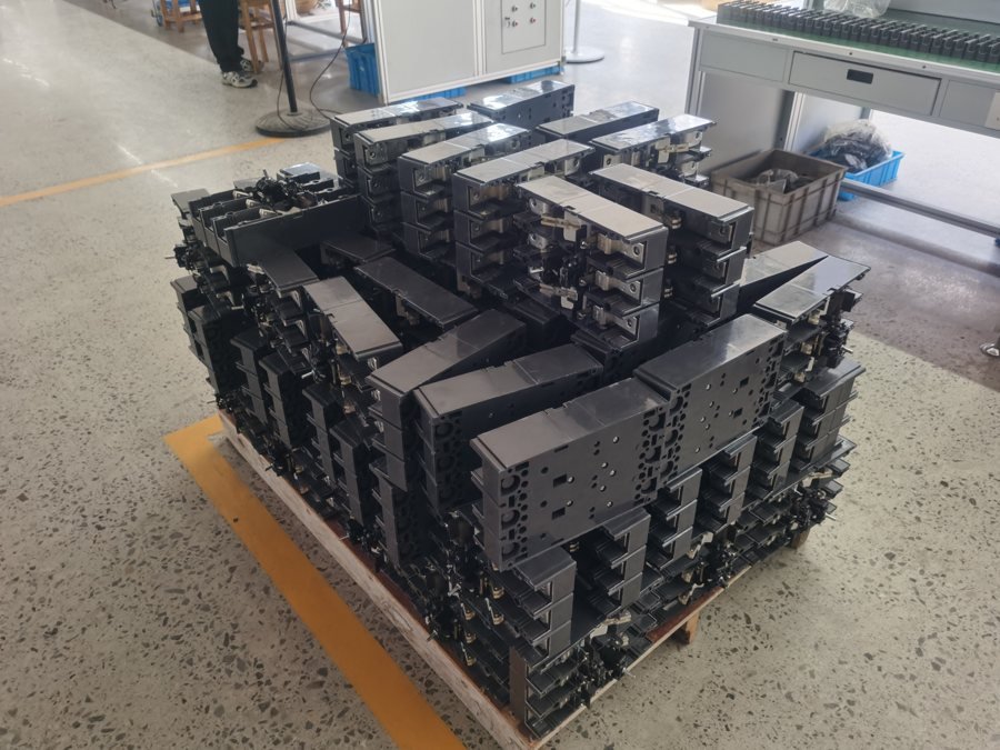 Transformer core stacking and quality inspection at the Wilmall factory bench