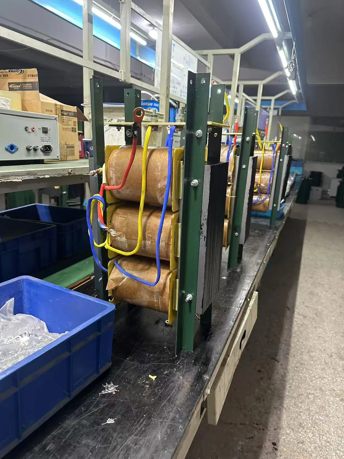 Wilmall production staff testing ST-2000 step down transformer on test bench