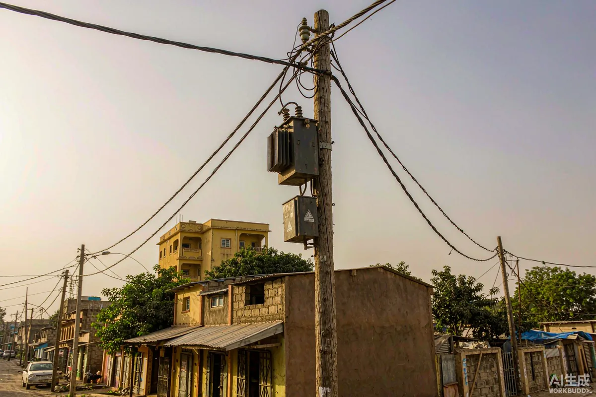Distribution transformer on a power pole serving a West African street