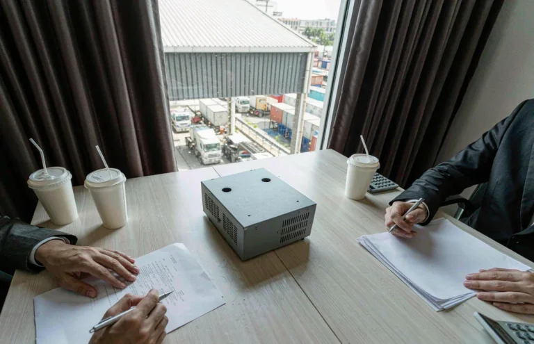 Transformer sample on a table during an export sales meeting about payment terms