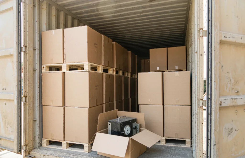 Transformers packed in cartons inside a shipping container ready for export